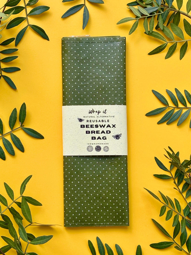 Eco-friendly reusable beeswax bread bag holding a fresh artisan sourdough loaf, made from organic cotton and natural beeswax—perfect for plastic-free, sustainable sourdough bread storage