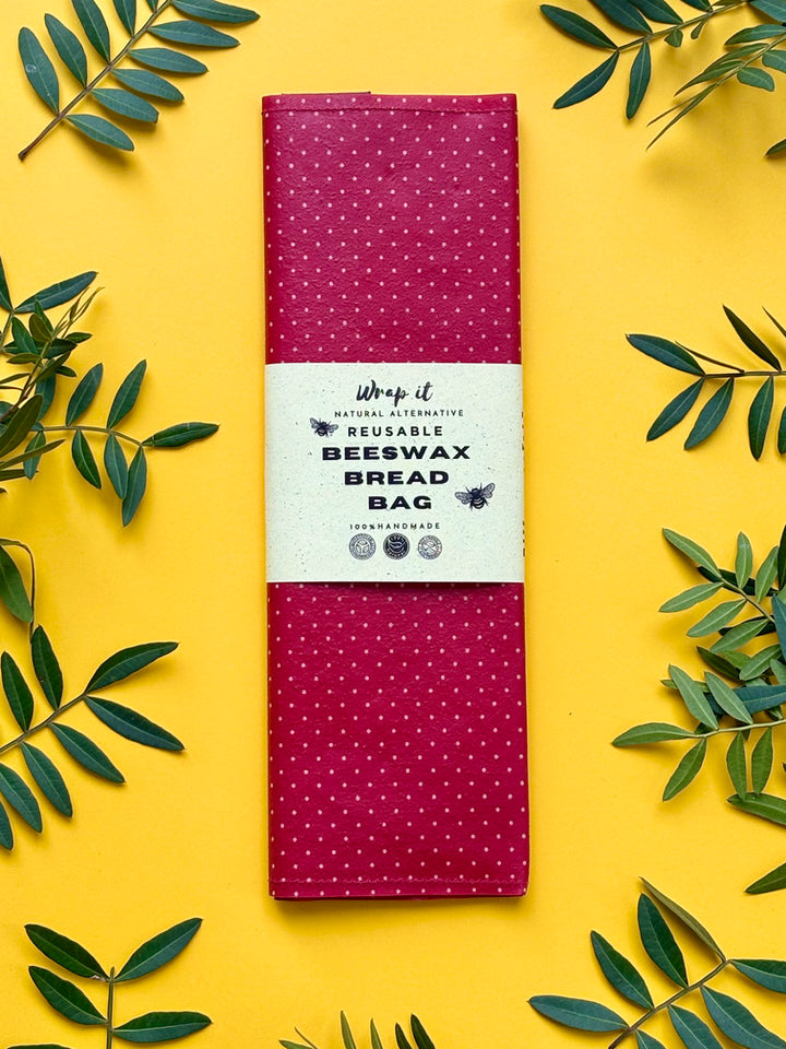 Eco-friendly reusable beeswax bread bag holding a fresh artisan sourdough loaf, made from organic cotton and natural beeswax—perfect for plastic-free, sustainable sourdough bread storage