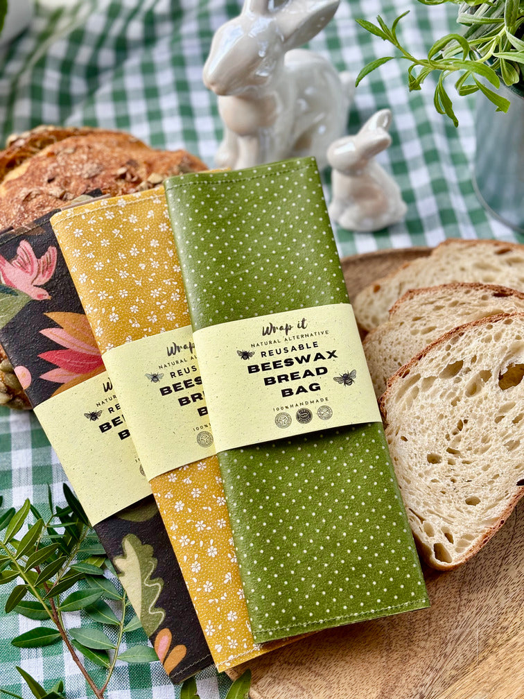 Eco-friendly reusable beeswax bread bag holding a fresh artisan sourdough loaf, made from organic cotton and natural beeswax—perfect for plastic-free, sustainable sourdough bread storage