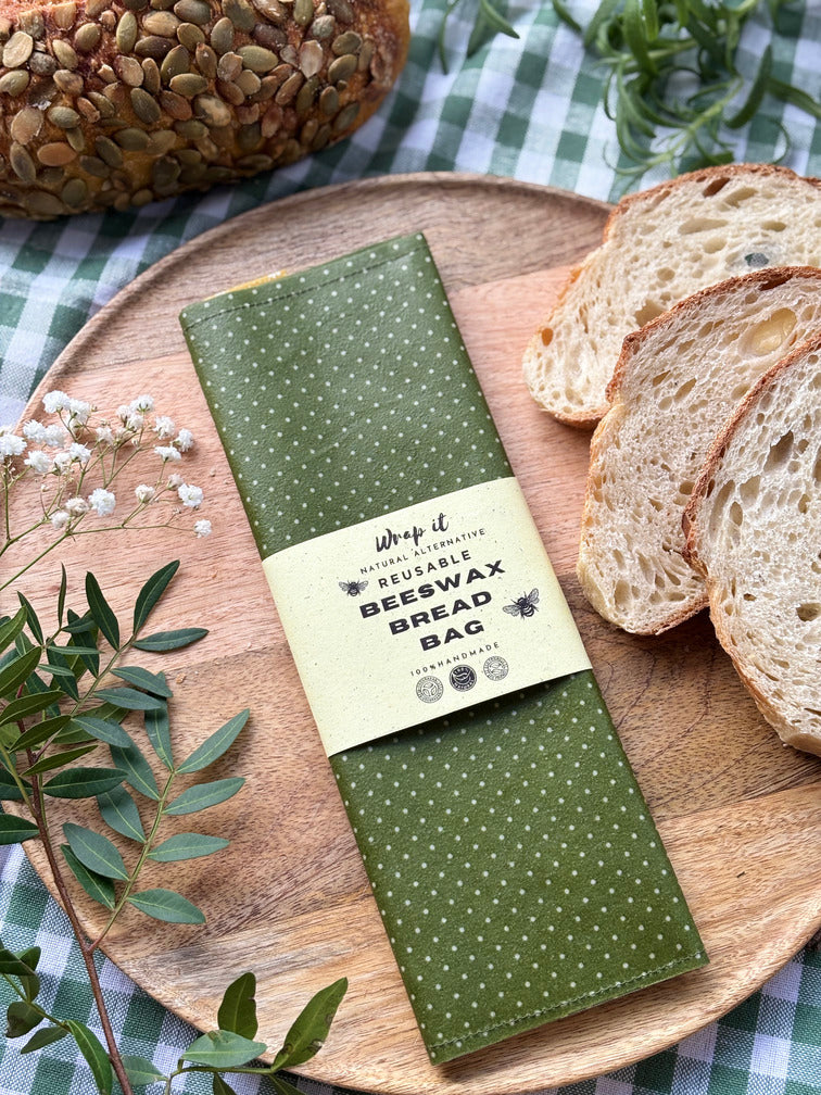 Eco-friendly reusable beeswax bread bag holding a fresh artisan sourdough loaf, made from organic cotton and natural beeswax—perfect for plastic-free, sustainable sourdough bread storage