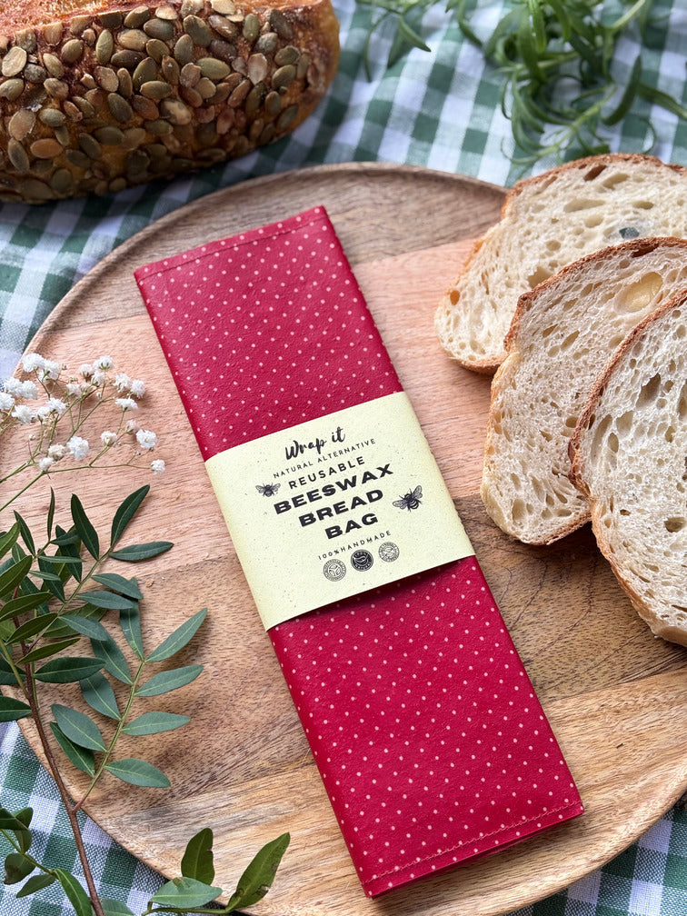 Eco-friendly reusable beeswax bread bag holding a fresh artisan sourdough loaf, made from organic cotton and natural beeswax—perfect for plastic-free, sustainable sourdough bread storage