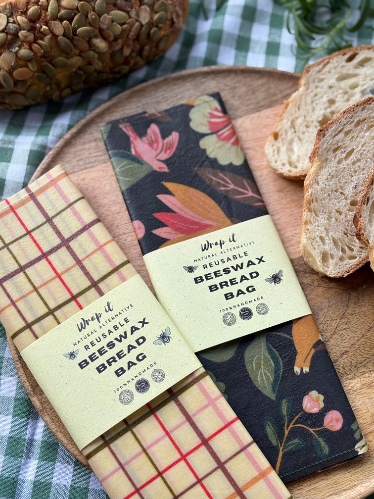 Eco-friendly reusable beeswax bread bag holding a fresh artisan sourdough loaf, made from organic cotton and natural beeswax—perfect for plastic-free, sustainable sourdough bread storage