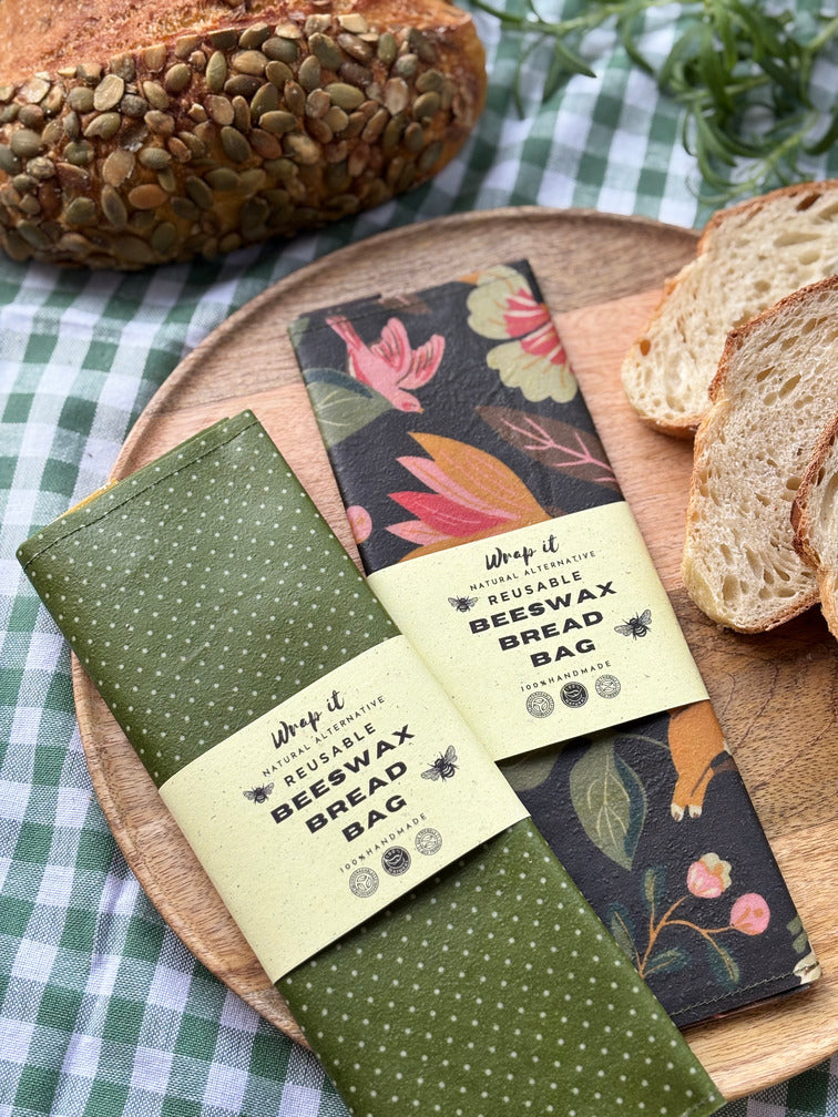 Eco-friendly reusable beeswax bread bag holding a fresh artisan sourdough loaf, made from organic cotton and natural beeswax—perfect for plastic-free, sustainable sourdough bread storage