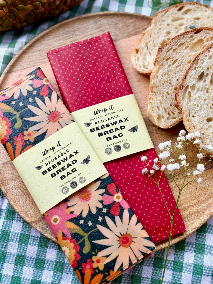 Eco-friendly reusable beeswax bread bag holding a fresh artisan sourdough loaf, made from organic cotton and natural beeswax—perfect for plastic-free, sustainable sourdough bread storage