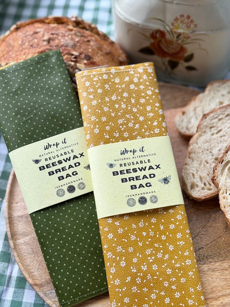 Eco-friendly reusable beeswax bread bag holding a fresh artisan sourdough loaf, made from organic cotton and natural beeswax—perfect for plastic-free, sustainable sourdough bread storage