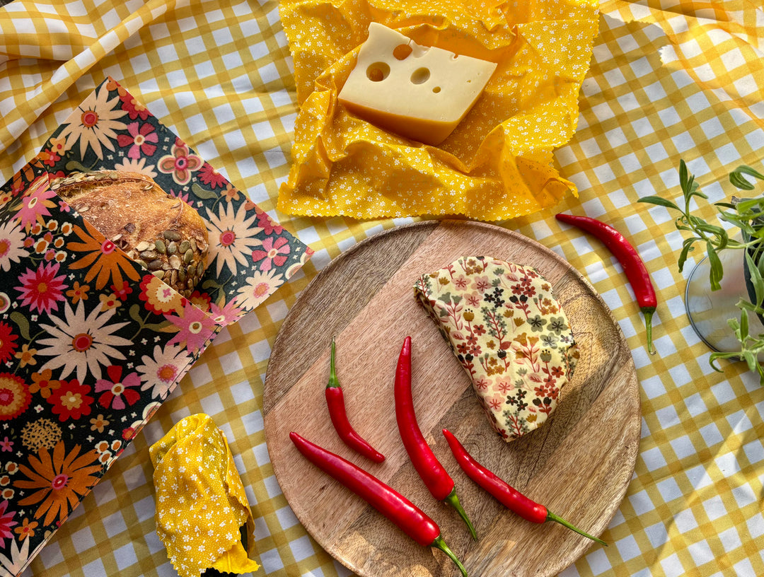 Eco-friendly reusable beeswax bread bag holding a fresh artisan sourdough loaf, made from organic cotton and natural beeswax—perfect for plastic-free, sustainable sourdough bread storage